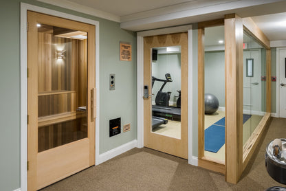 Center Harbor Inn wellness corner with a cedar sauna and a glass-walled fitness room